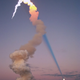 Illustration for article titled An ordinary space shuttle launch (apparently) shot a blue laser at the Moon
